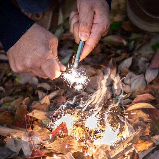 Action photo of Sparkforge Rod igniting tinder with bright magnesium sparks. Demonstrates real outdoor fire-starting performance — powerful ignition even in damp or windy conditions.