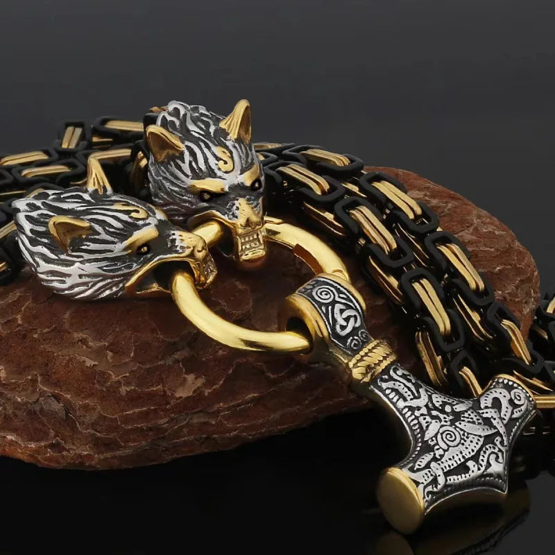 Fenrir's Fang Mjölnir necklace with wolf head motif gripping Thor's hammer pendant on gold-black chain