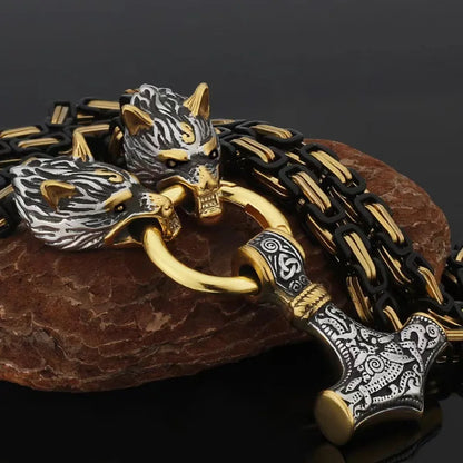 Fenrir's Fang Mjölnir necklace with wolf head motif gripping Thor's hammer pendant on gold-black chain