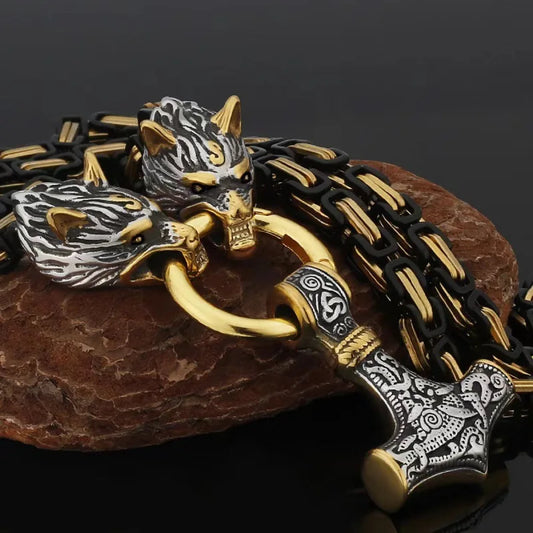 Fenrir's Fang Mjölnir necklace with wolf head motif gripping Thor's hammer pendant on gold-black chain