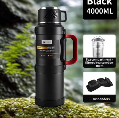 Extra-large 4000ml Frostbear Flask thermos bottle in black. Industrial-grade stainless steel vacuum insulation keeps drinks hot or cold for 72 hours. Built for survival, basecamps, and expedition use with carry strap and cup lid.