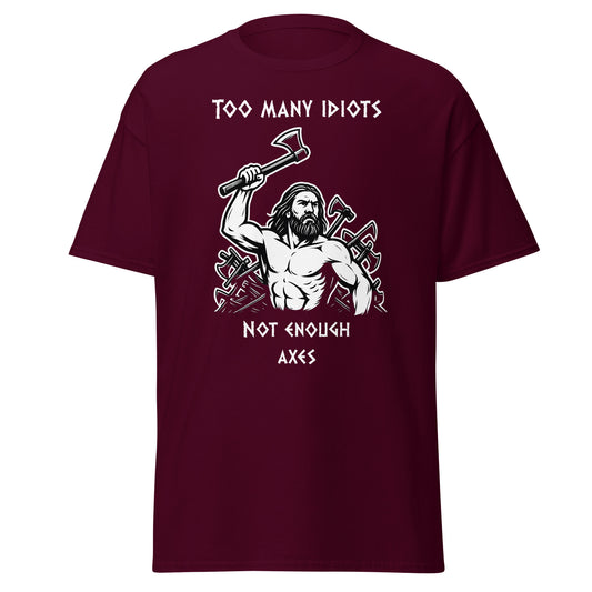 Rage of Blades – Norse Tee in Maroon, front mockup showing Viking warrior raising axe with pile of used axes behind him and quote "Too many idiots not enough axes"; bold Norse streetwear design for men and unisex.