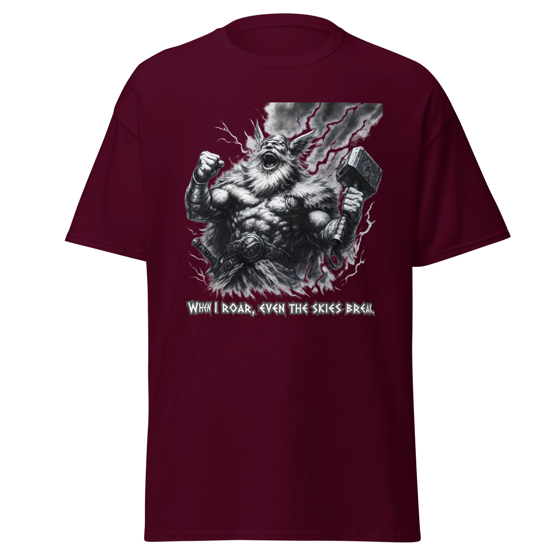 Skyshatter – Norse Tee in Maroon, front mockup with laughing thunder-god figure holding Mjölnir as lightning cracks the sky and quote "When I roar, even the skies break"; premium Norse graphic tee for bold warriors.