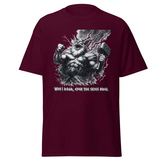 Skyshatter – Norse Tee in Maroon, front mockup with laughing thunder-god figure holding Mjölnir as lightning cracks the sky and quote "When I roar, even the skies break"; premium Norse graphic tee for bold warriors.